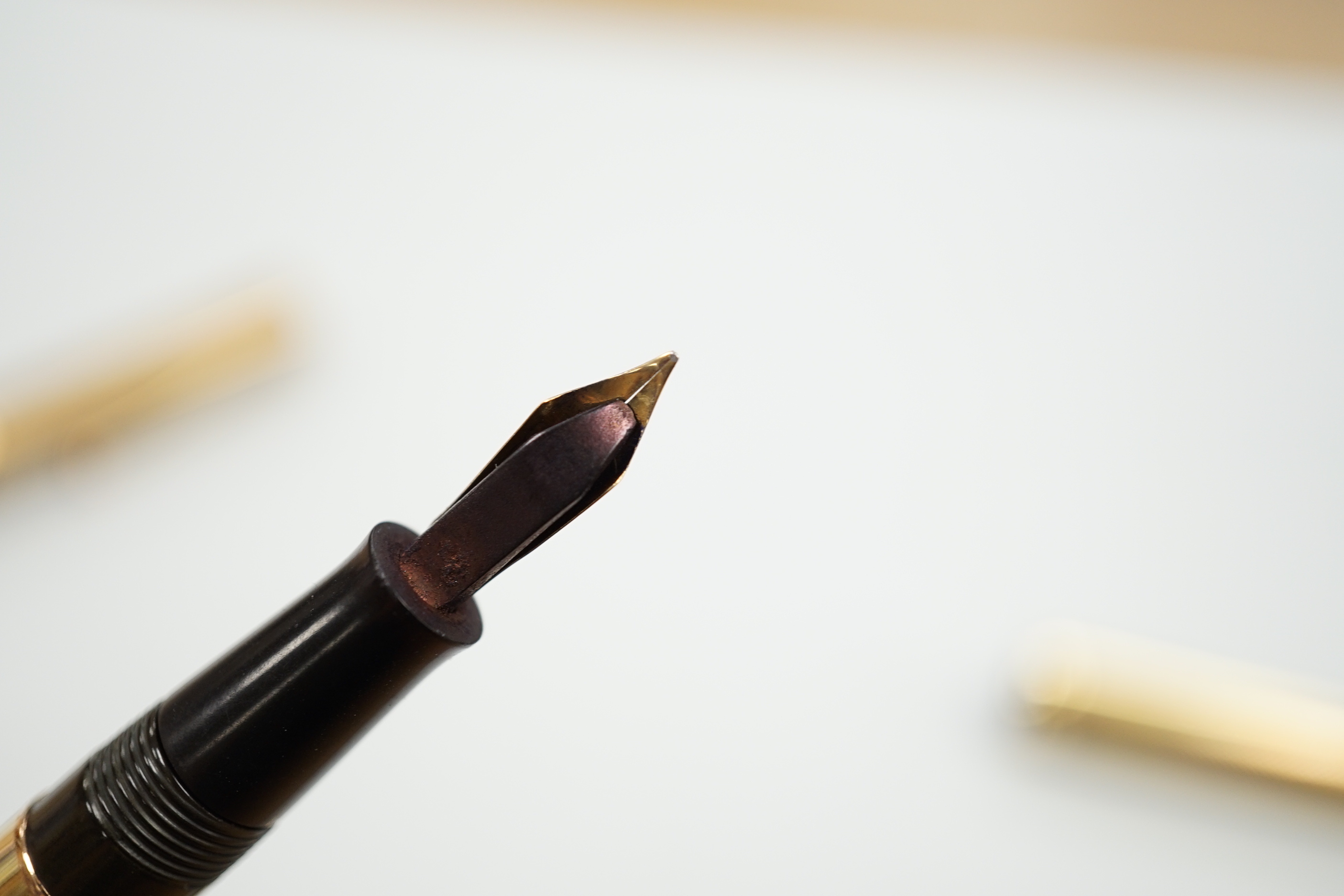 A 9ct gold Waterman fountain pen (missing lever) and two Conway Stewart fountain pens
